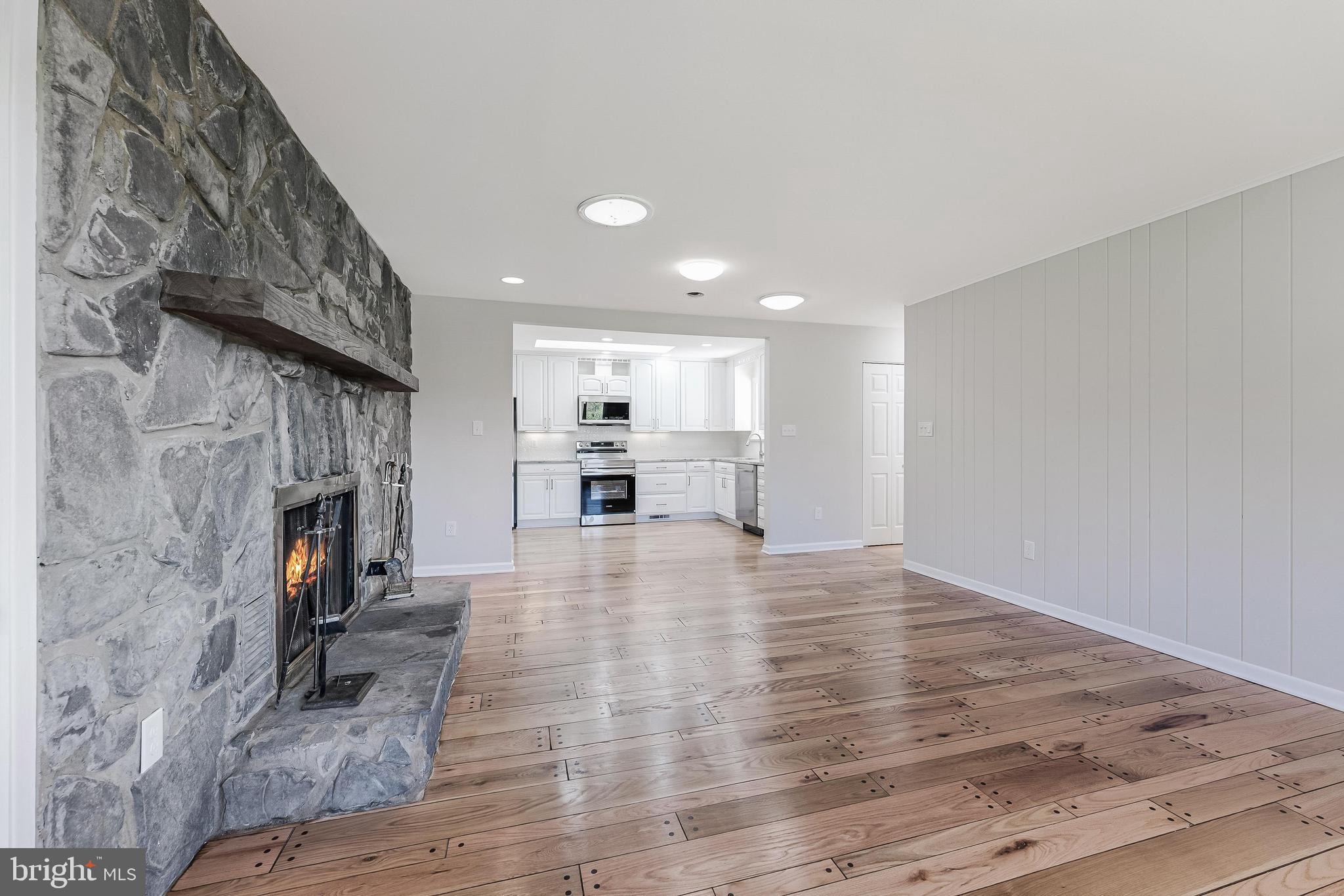 6891 Wilson Road Marshall, VA 20115 - Photo 57 of 118 Spacious living area with stone fireplace.