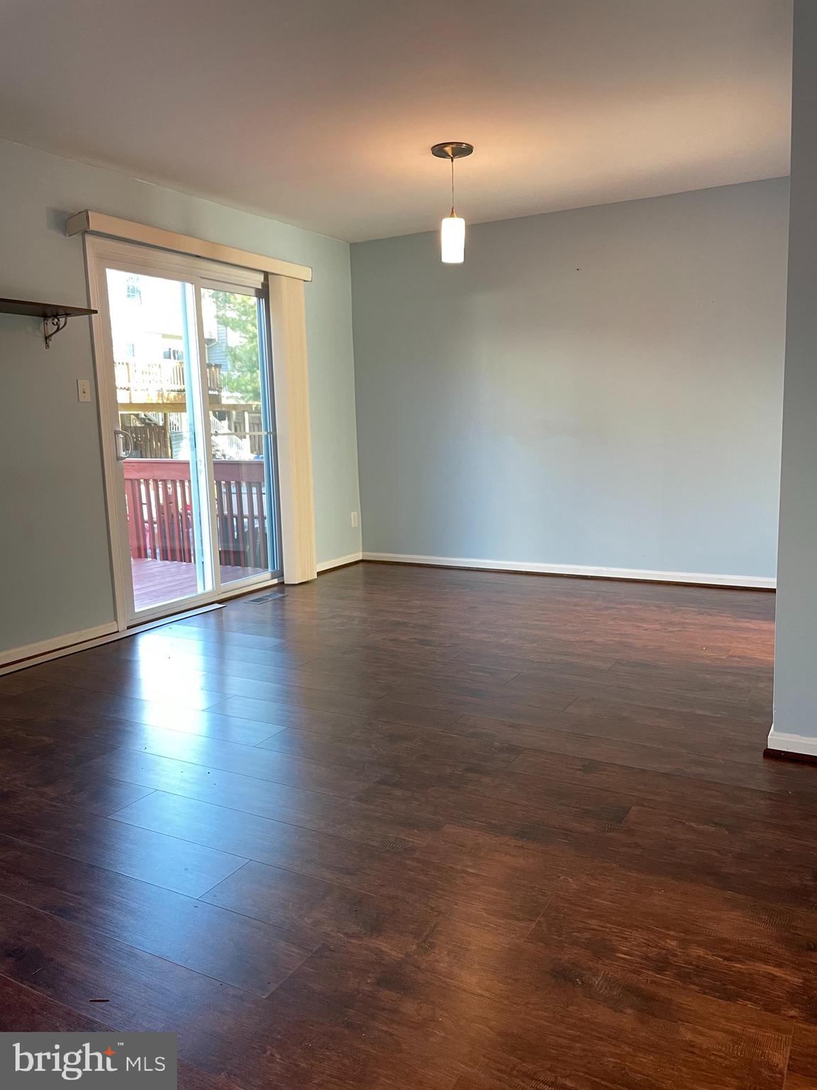 12405 Gooderham Way Gaithersburg, MD 20878 - Photo 10 of 31 an empty room with wooden floor and windows