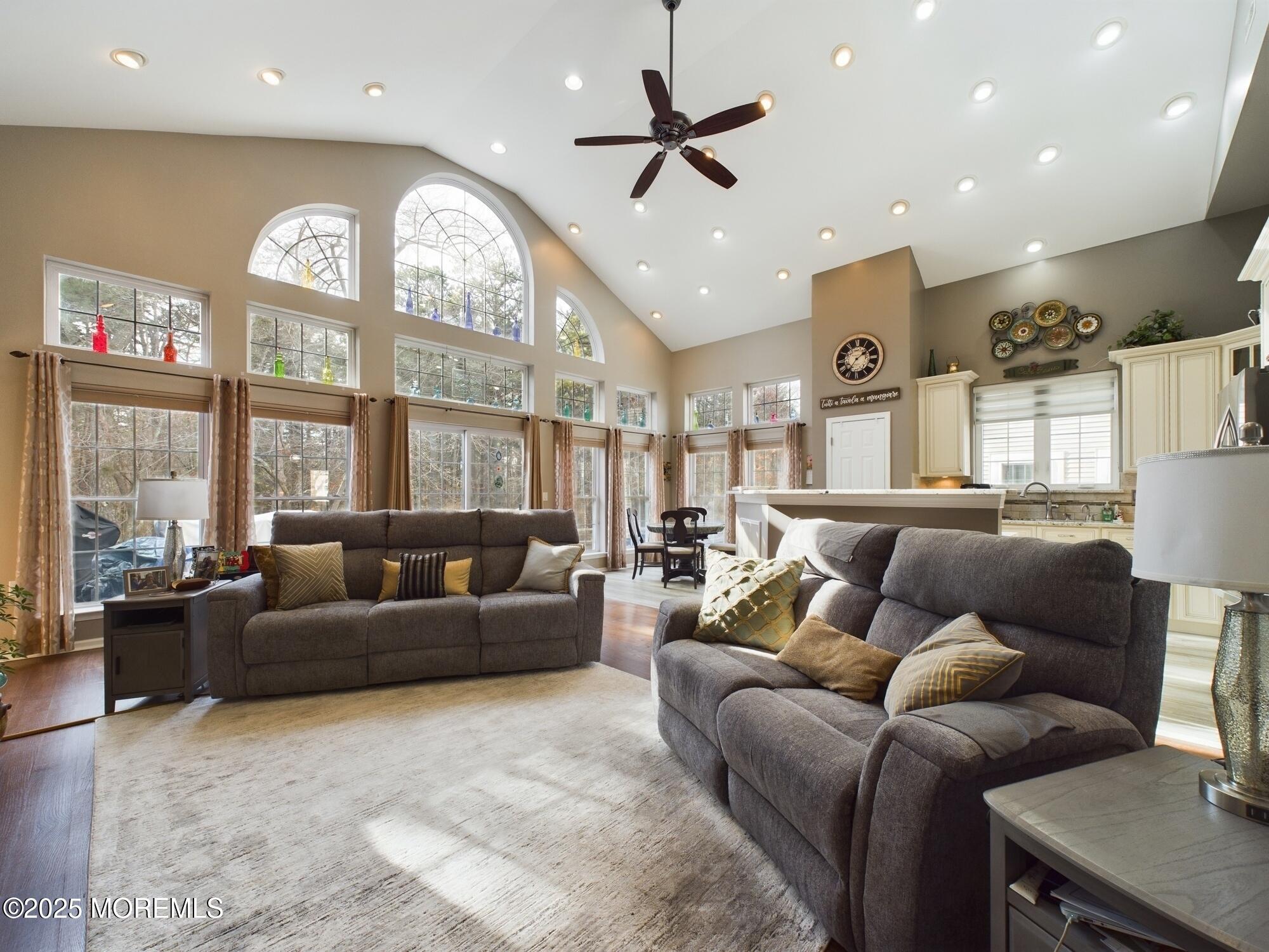 89 Pebble Beach Boulevard Jackson, NJ 08527 - Photo 15 of 42 a living room with furniture a large window and a clock