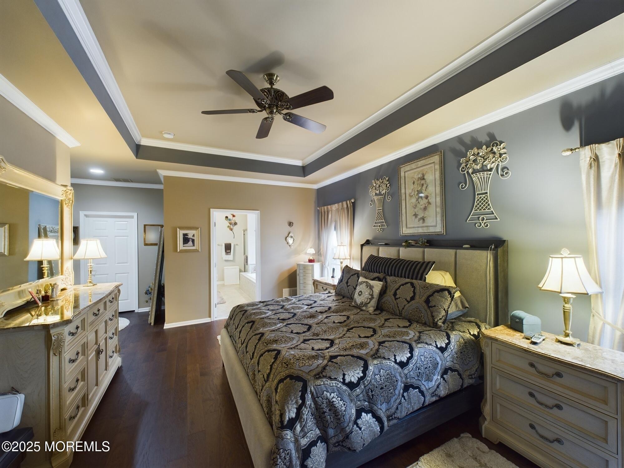 89 Pebble Beach Boulevard Jackson, NJ 08527 - Photo 24 of 42 a bedroom with a bed and a chandelier
