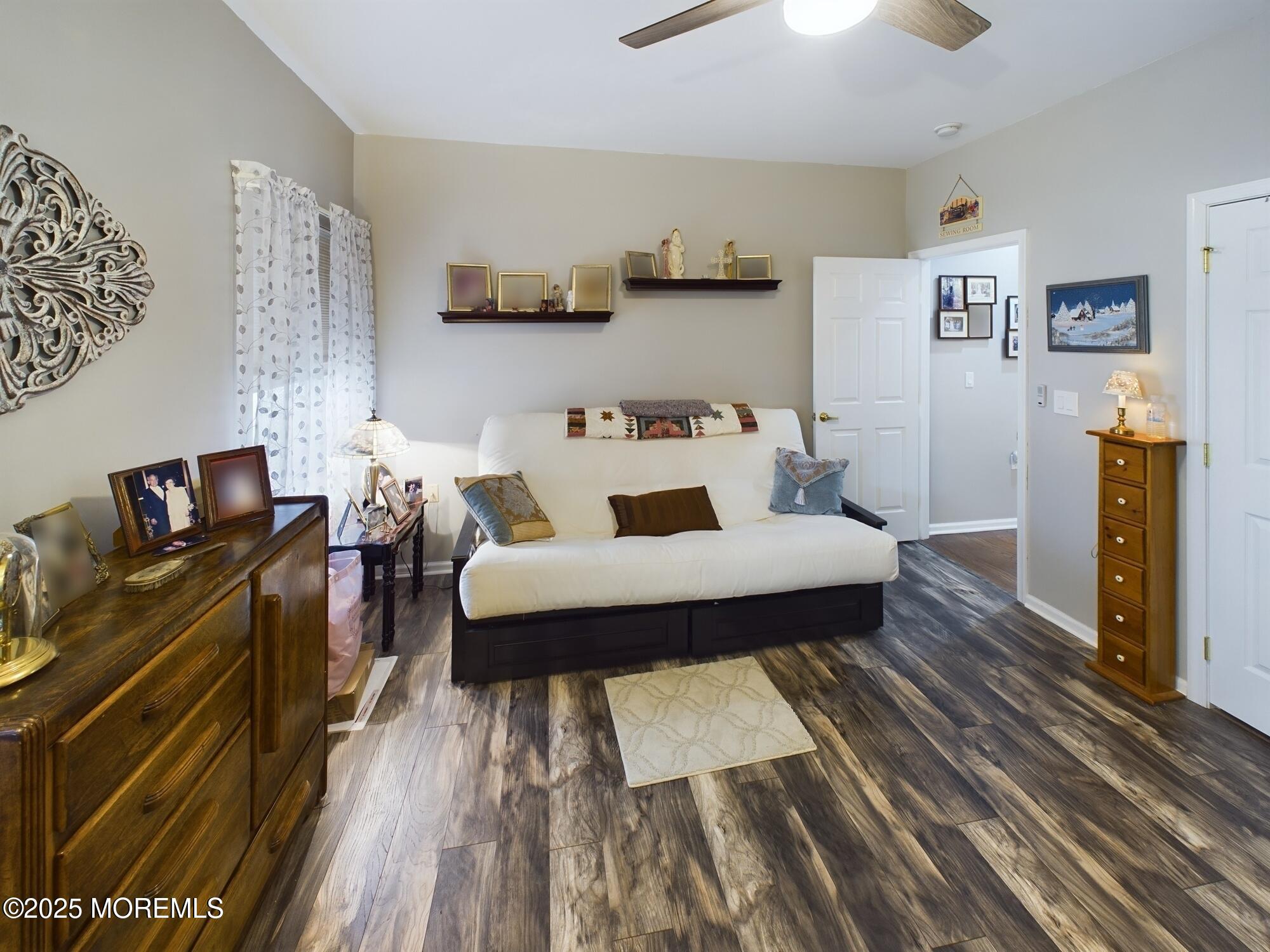 89 Pebble Beach Boulevard Jackson, NJ 08527 - Photo 29 of 42 a living room with furniture and a wooden floor
