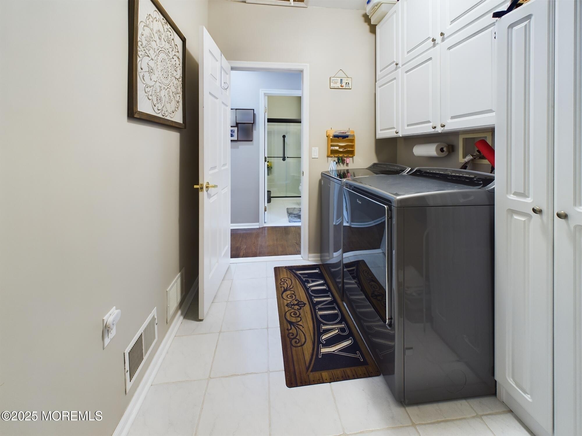 89 Pebble Beach Boulevard Jackson, NJ 08527 - Photo 31 of 42 a kitchen with stainless steel appliances a refrigerator a stove and white cabinets