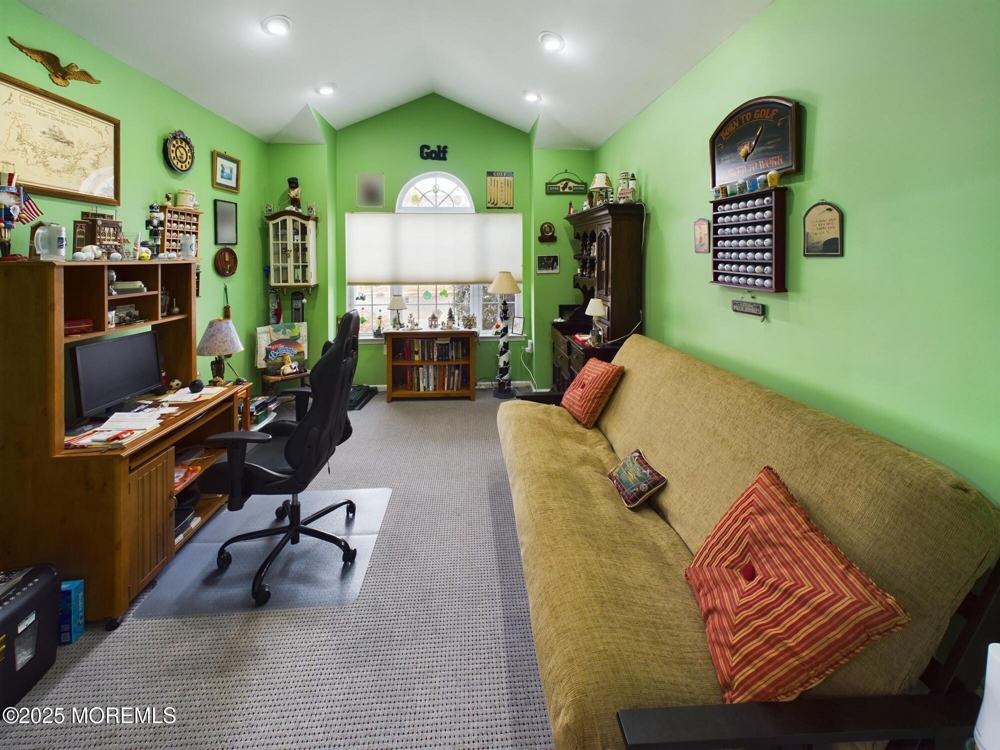 89 Pebble Beach Boulevard Jackson, NJ 08527 - Photo 33 of 42 a living room with furniture gym equipment and a flat screen tv