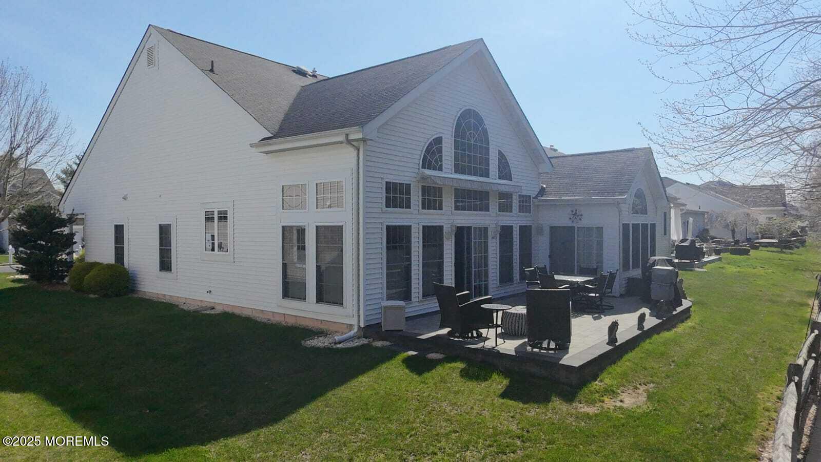 89 Pebble Beach Boulevard Jackson, NJ 08527 - Photo 37 of 42 a front view of a house with a yard table and chairs