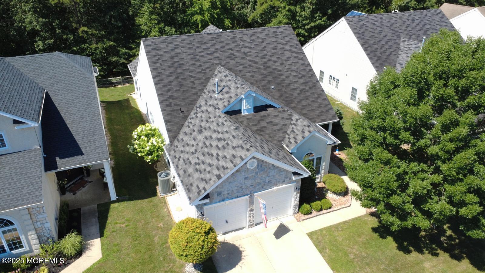 89 Pebble Beach Boulevard Jackson, NJ 08527 - Photo 4 of 42 an aerial view of a house with swimming pool and large trees