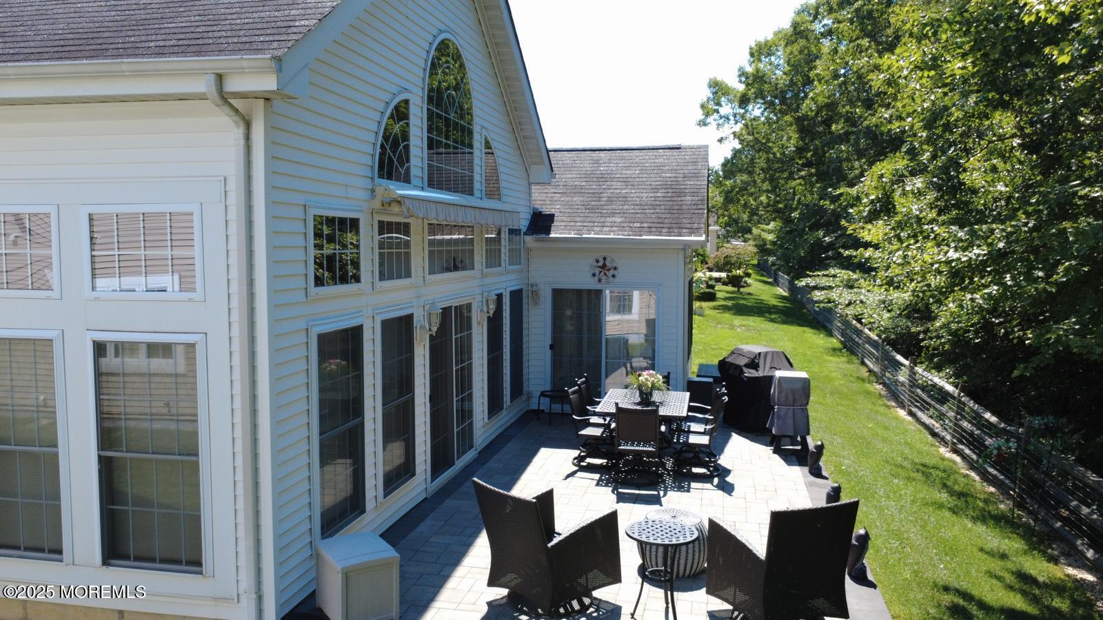 89 Pebble Beach Boulevard Jackson, NJ 08527 - Photo 41 of 42 a view of a patio with table and chairs and potted plants
