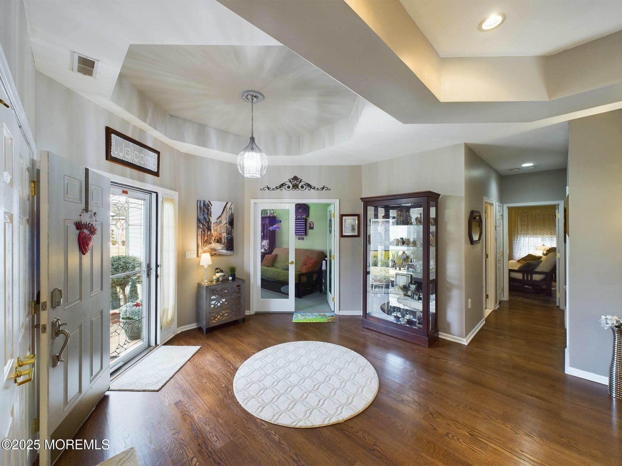 89 Pebble Beach Boulevard Jackson, NJ 08527 - Photo 5 of 42 a view of livingroom with furniture wooden floor and windows