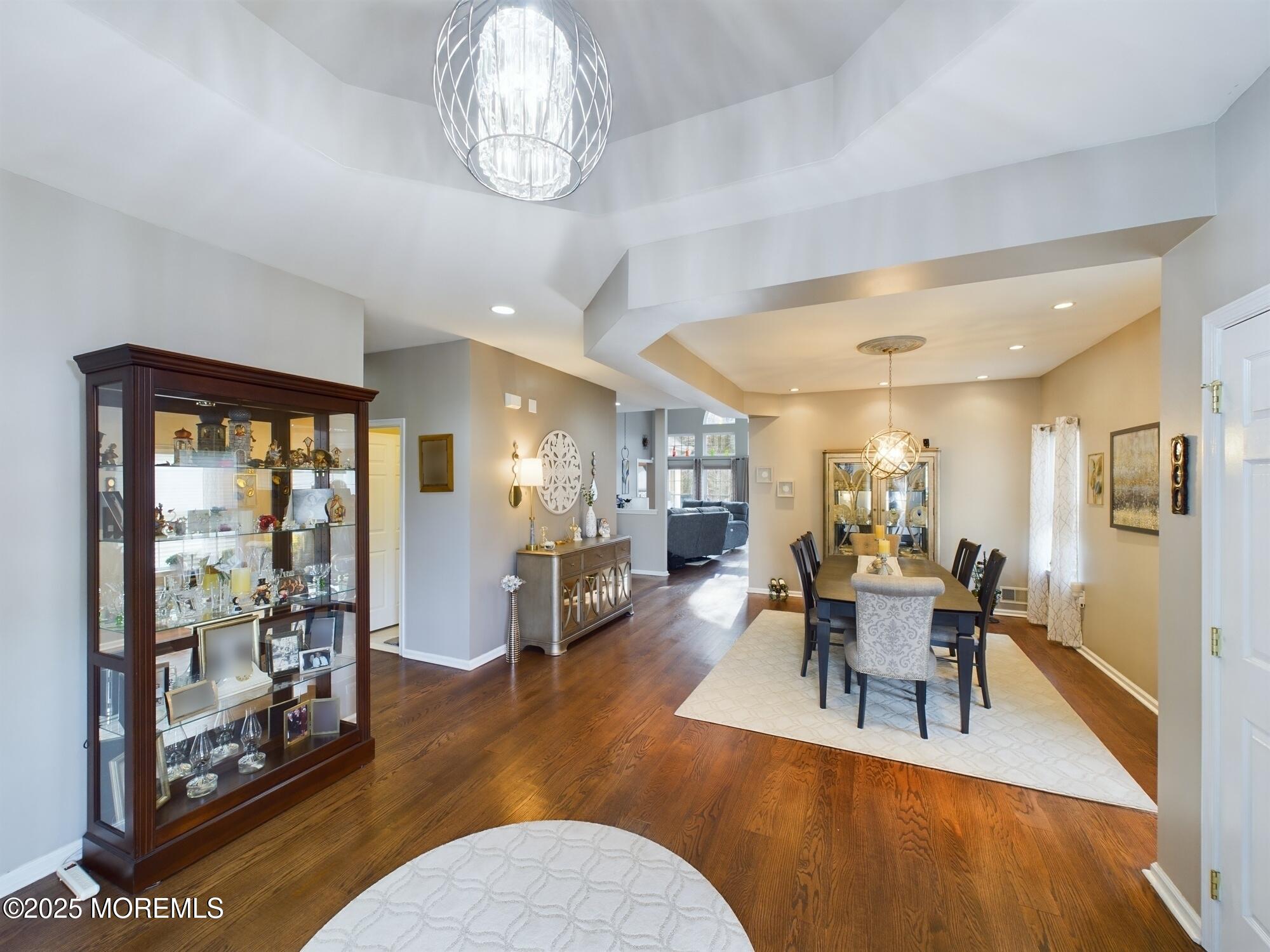89 Pebble Beach Boulevard Jackson, NJ 08527 - Photo 7 of 42 a view of a dining room with furniture wooden floor and chandelier