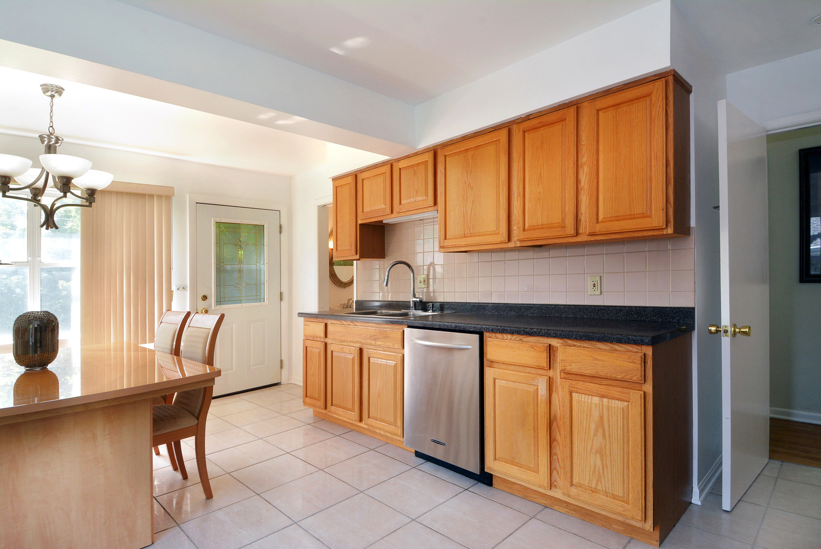 604 South Elmhurst Road South Mount Prospect, IL 60056 - Photo 12 of 18 a kitchen with stainless steel appliances granite countertop a sink and cabinets