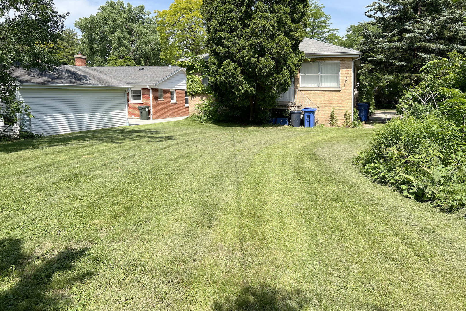 604 South Elmhurst Road South Mount Prospect, IL 60056 - Photo 17 of 18 a front view of a house with yard and garage
