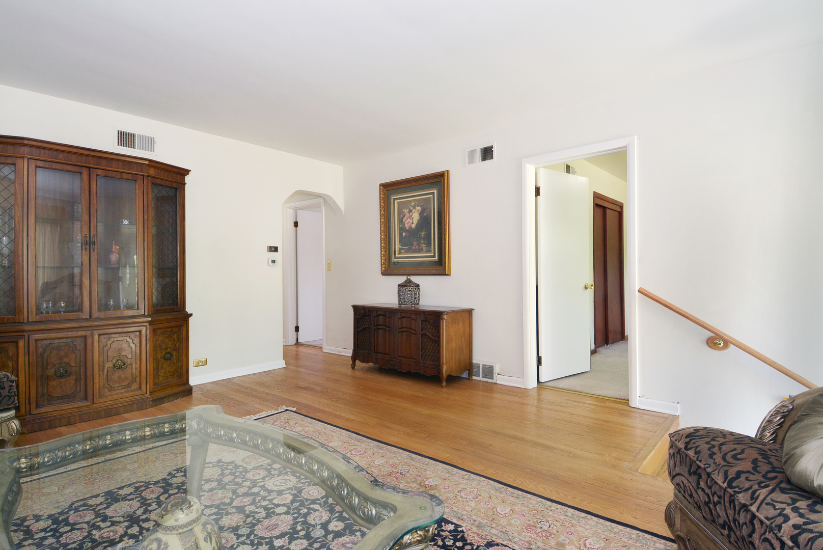 604 South Elmhurst Road South Mount Prospect, IL 60056 - Photo 5 of 18 a living room with furniture and a rug
