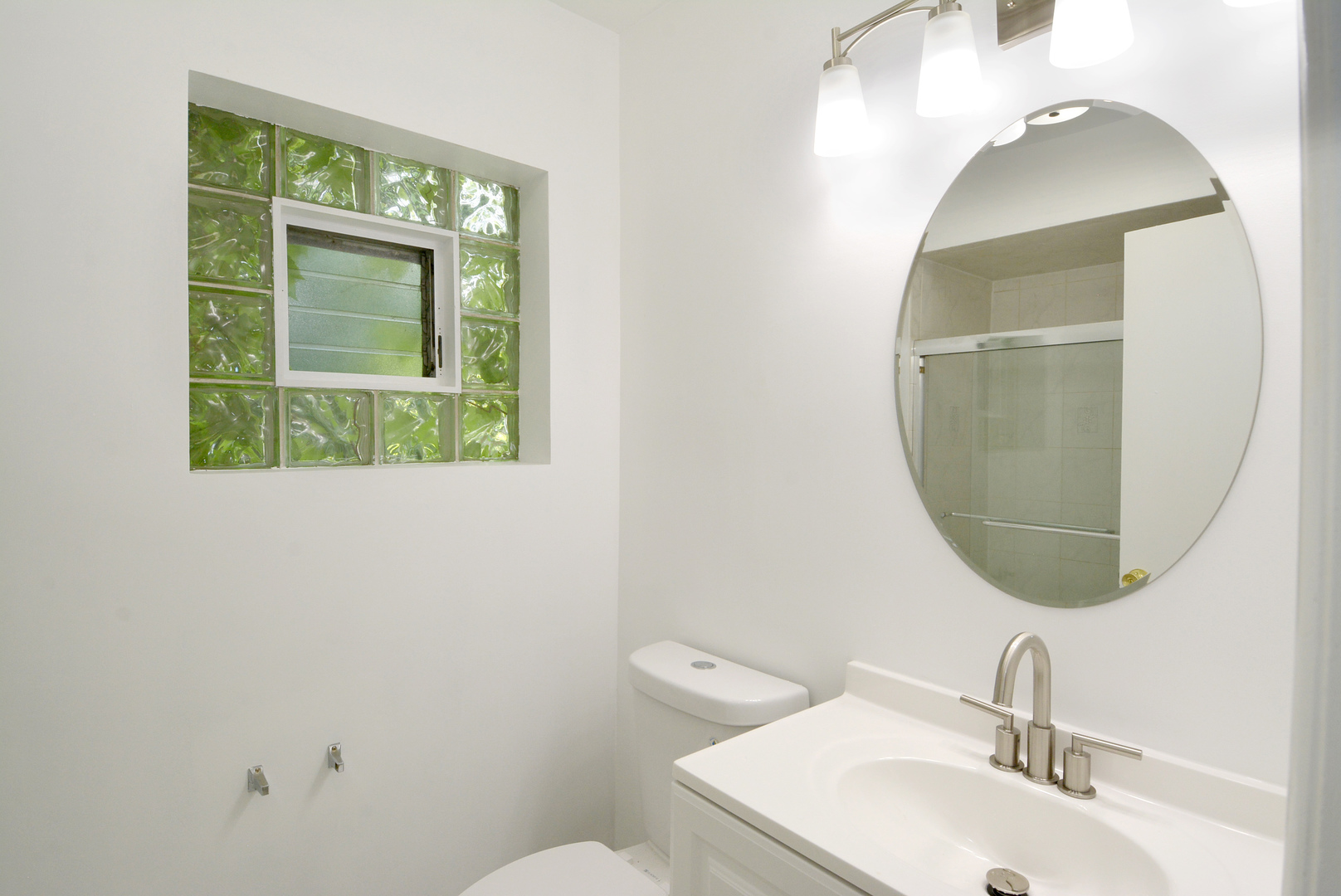604 South Elmhurst Road South Mount Prospect, IL 60056 - Photo 10 of 18 a bathroom with a sink and a mirror
