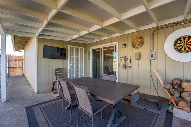 a view of a dining room with furniture and a table