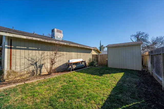 a view of a back yard of the house