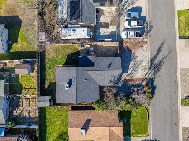 an aerial view of houses with outdoor space