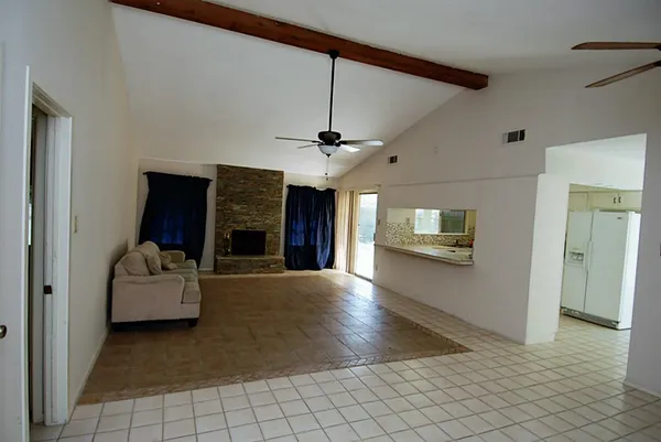 a kitchen with a refrigerator and a sink