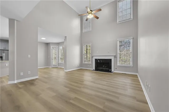 a view of an empty room with a fireplace