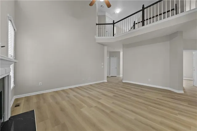 a kitchen with stainless steel appliances a sink a stove a refrigerator cabinets and a counter top space