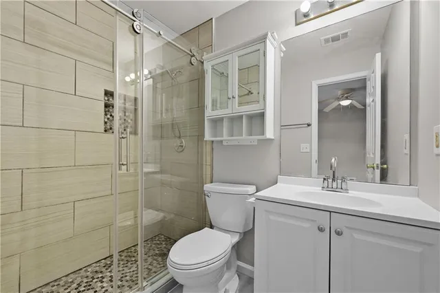 a bathroom with double vanity sink a vanity and a mirror