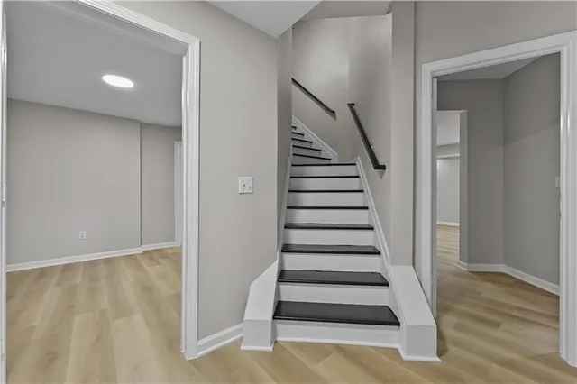 a kitchen with cabinets appliances and a sink