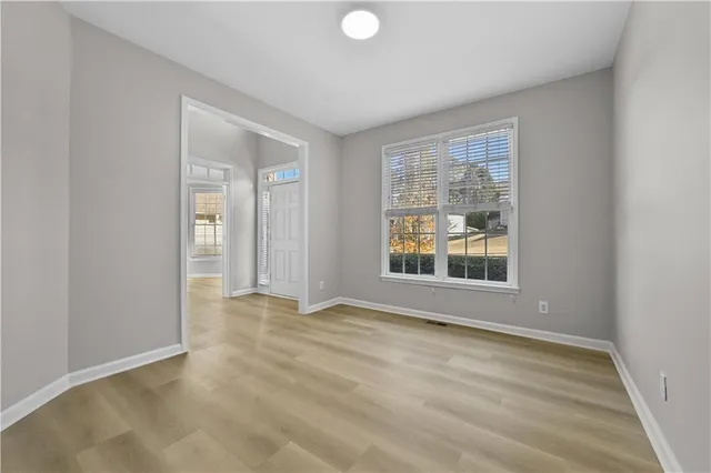 a view of an empty room with a window