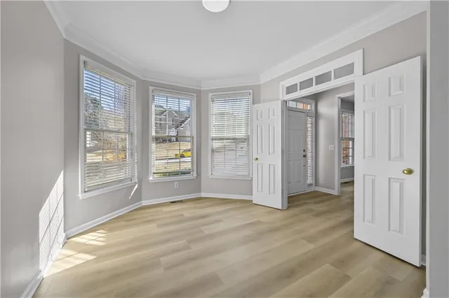 a view of an empty room with a window