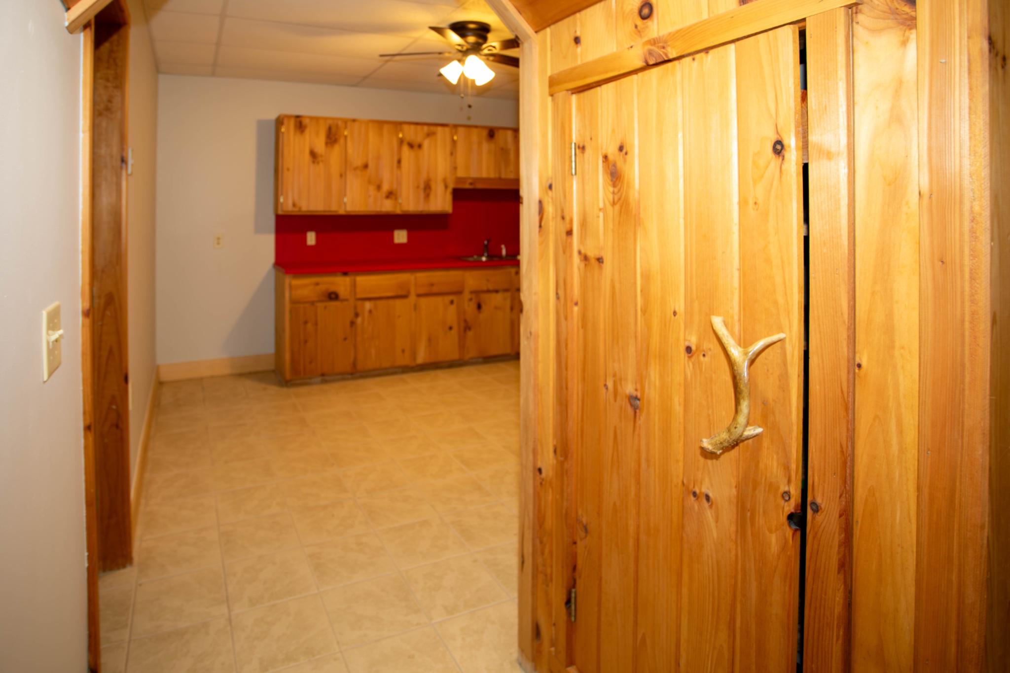161 Coyote Run Mathias, WV 26812 - Photo 65 of 88 Charming entry to LL kitchen with rustic accents.