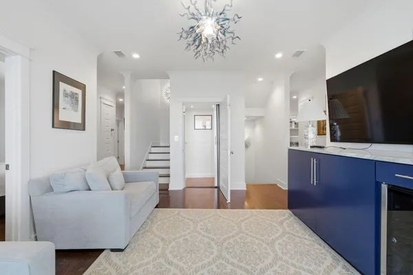 a bathroom with a granite countertop sink a toilet and shower