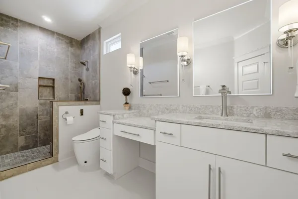 a kitchen with a dining table chairs wooden floor and appliances