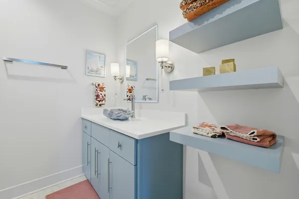 a kitchen with stainless steel appliances granite countertop a kitchen island a stove and a sink