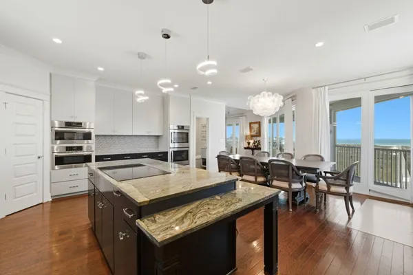 a view of a balcony with couch and wooden floor