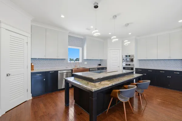 a view of balcony with wooden floor and outdoor seating