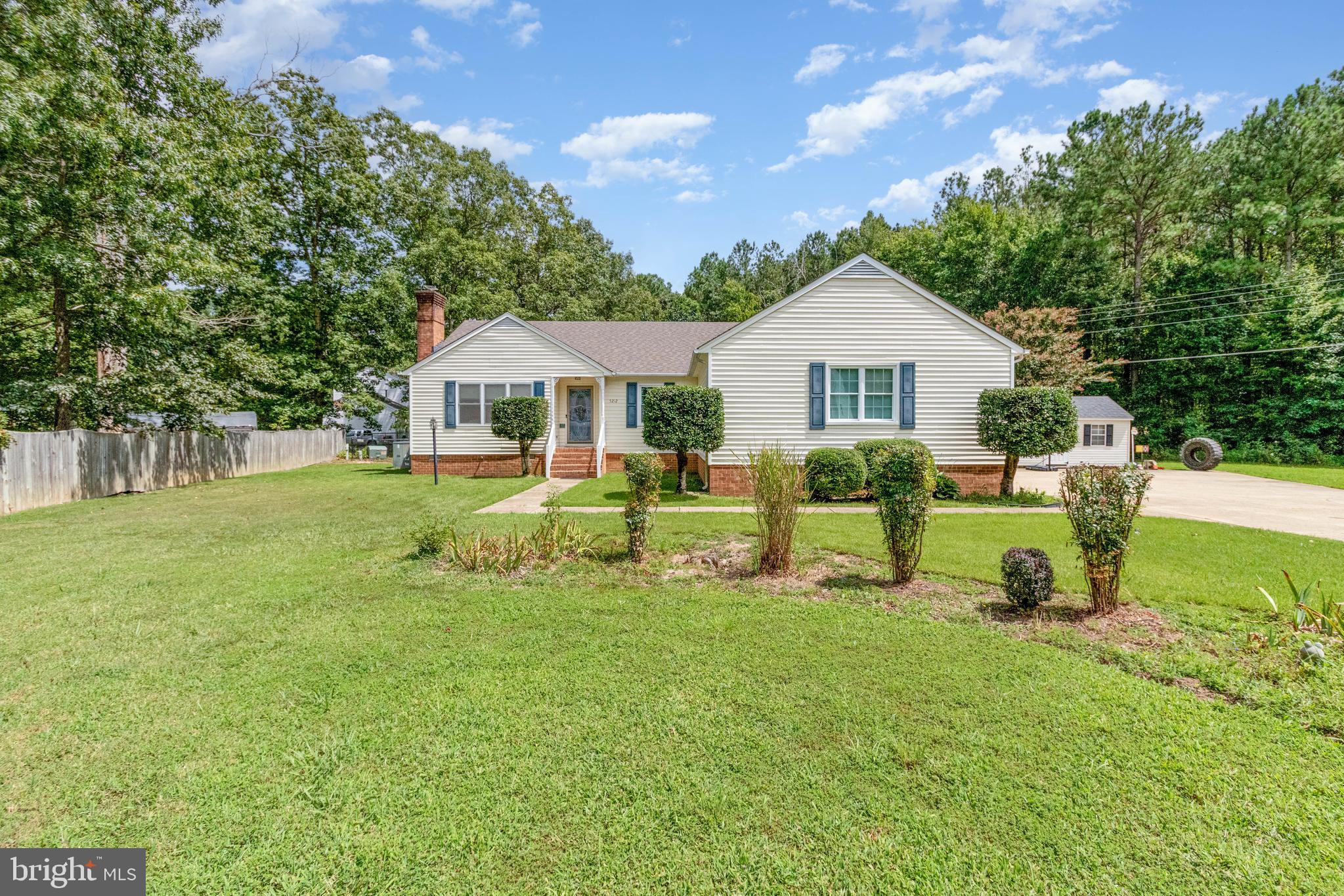5212 Farmcrest Circle Prince George, VA 23875 - Photo 1 of 27 a view of a house with a backyard porch and sitting area