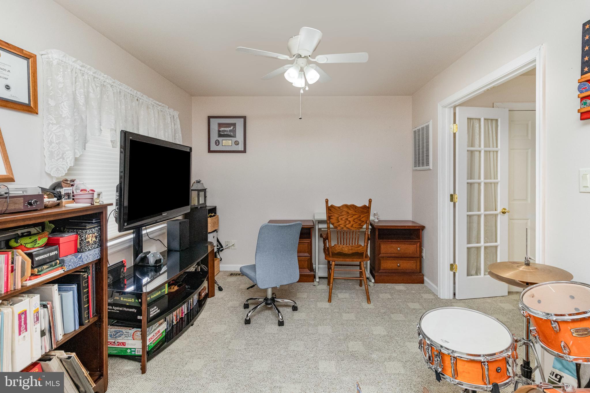 5212 Farmcrest Circle Prince George, VA 23875 - Photo 17 of 27 a living room with furniture and a flat screen tv