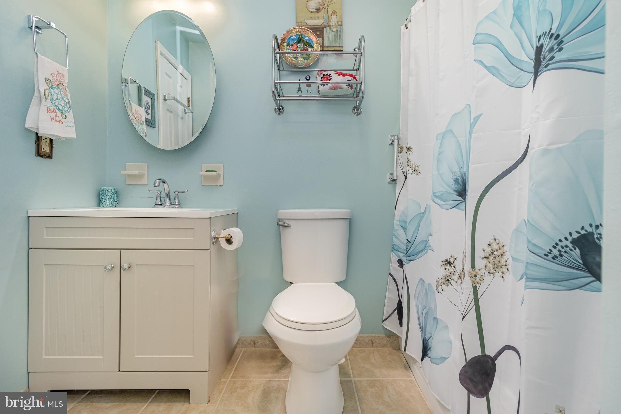 5212 Farmcrest Circle Prince George, VA 23875 - Photo 18 of 27 a bathroom with a toilet sink and vanity