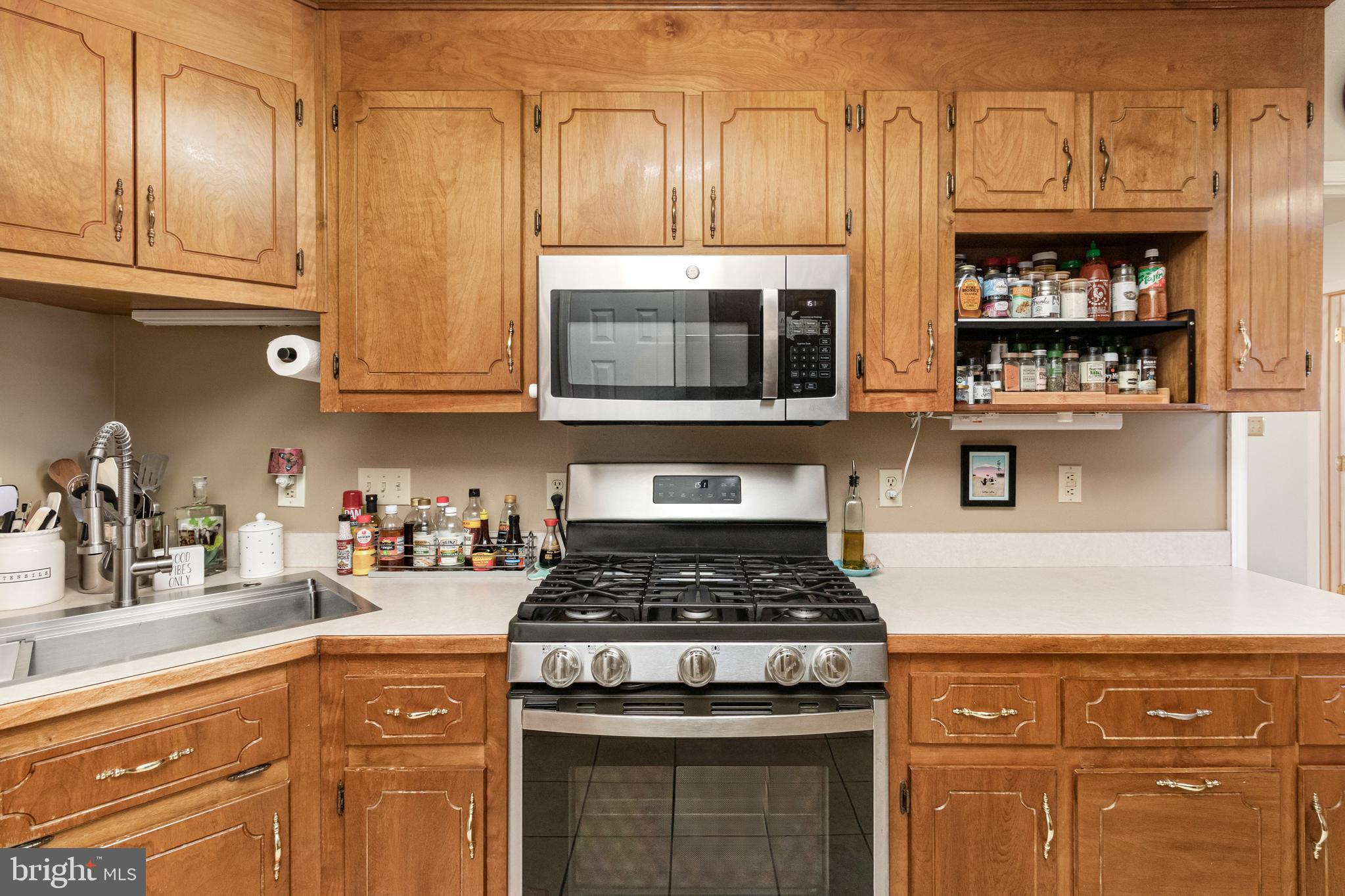 5212 Farmcrest Circle Prince George, VA 23875 - Photo 21 of 27 a kitchen with stainless steel appliances granite countertop a stove and cabinets