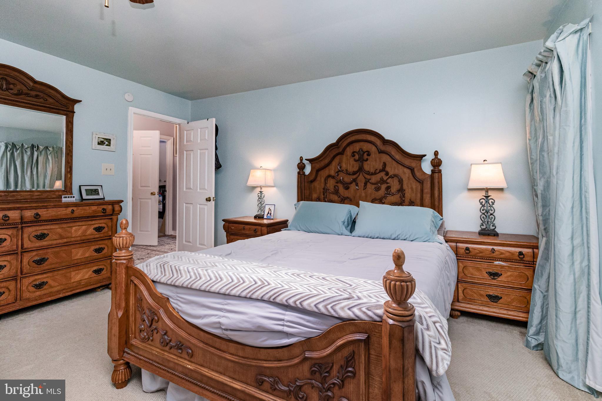 5212 Farmcrest Circle Prince George, VA 23875 - Photo 25 of 27 a bedroom with a bed and a dresser