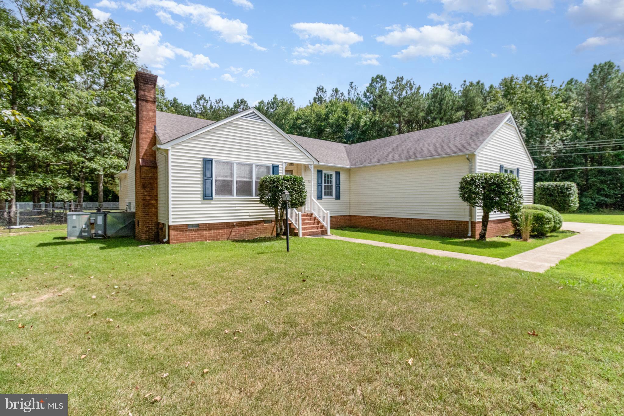 5212 Farmcrest Circle Prince George, VA 23875 - Photo 3 of 27 a front view of house with yard and green space