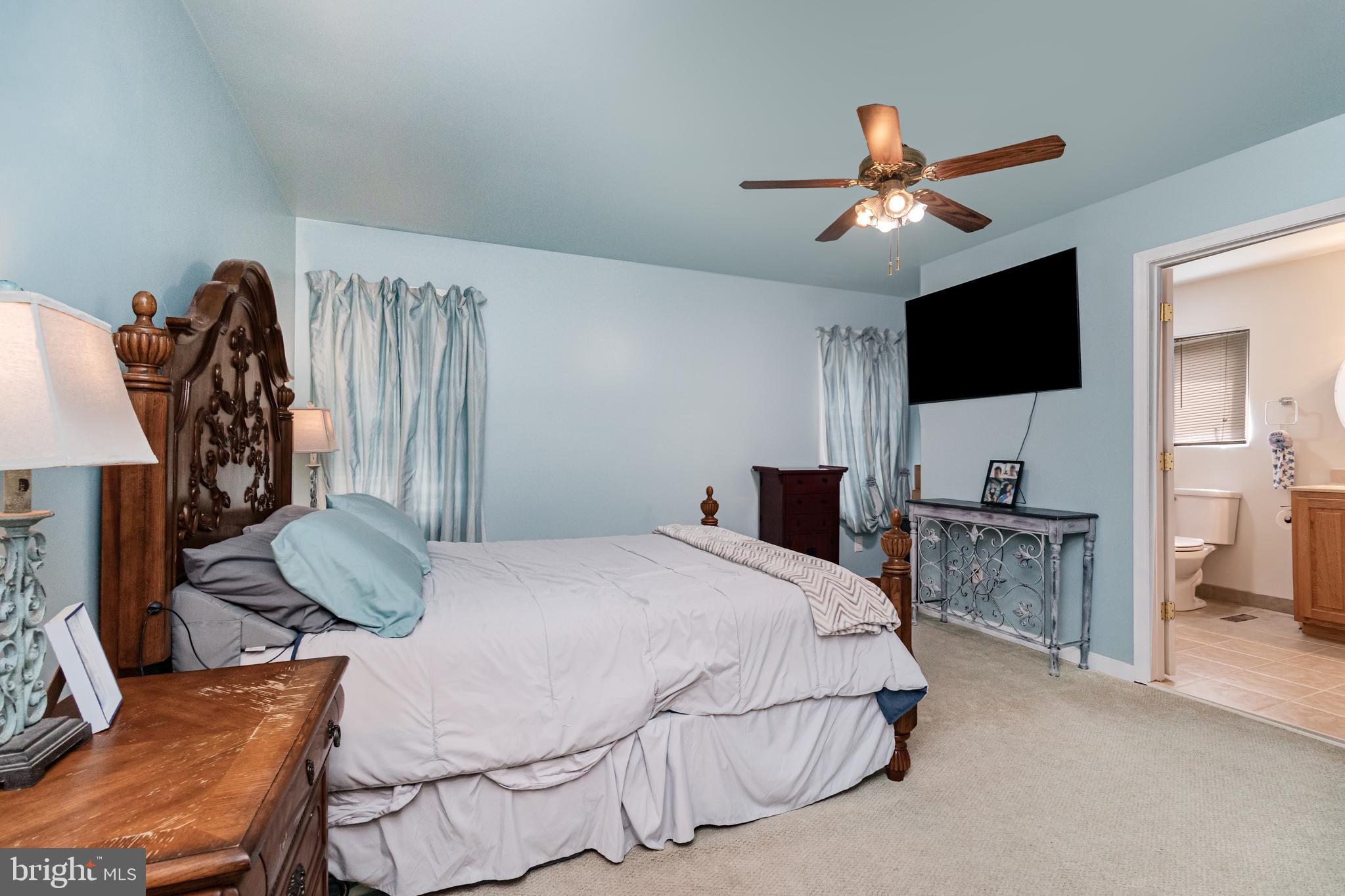 5212 Farmcrest Circle Prince George, VA 23875 - Photo 7 of 27 a bedroom with a bed and a television