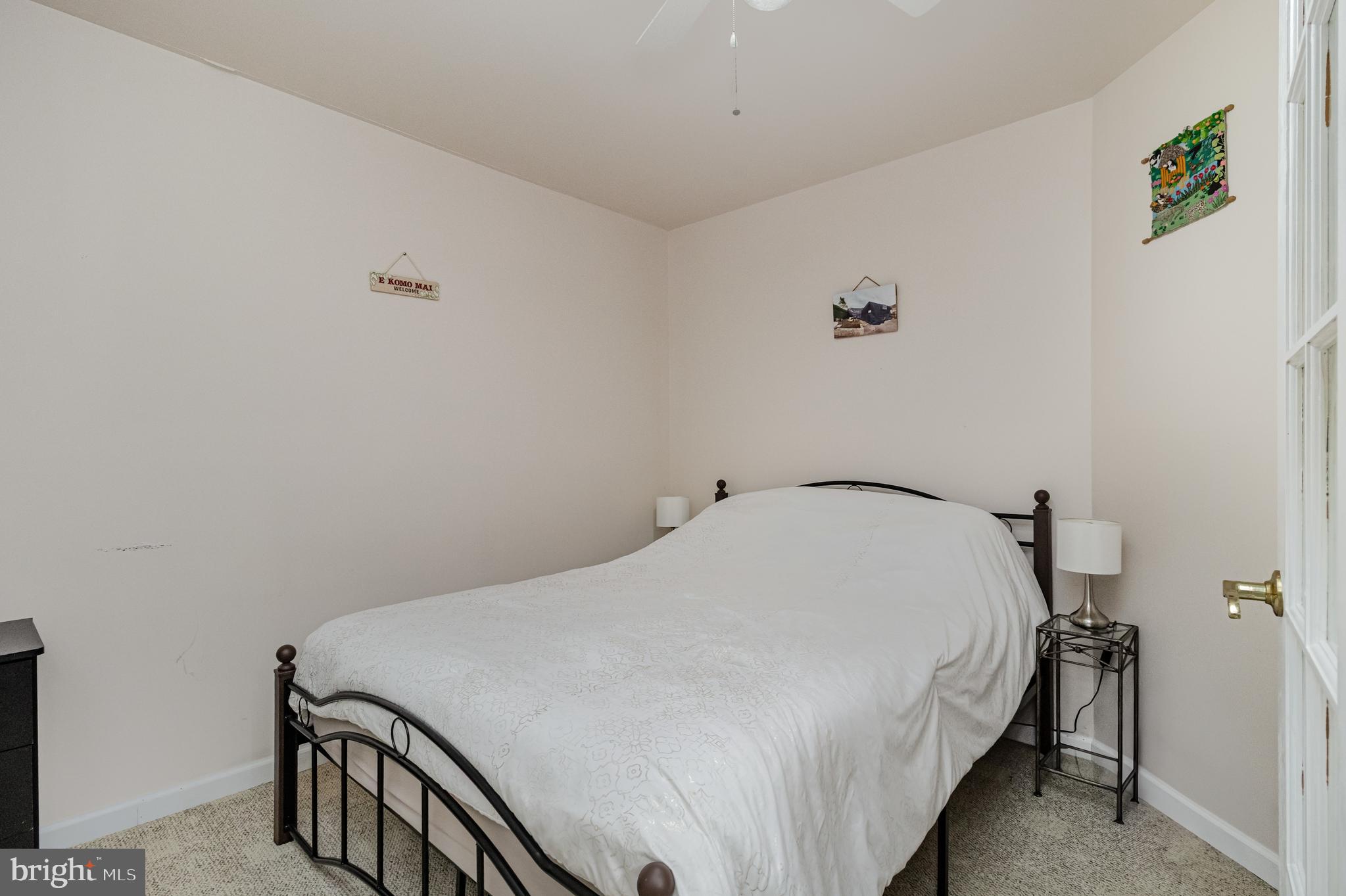 5212 Farmcrest Circle Prince George, VA 23875 - Photo 8 of 27 a bedroom with a bed and a window