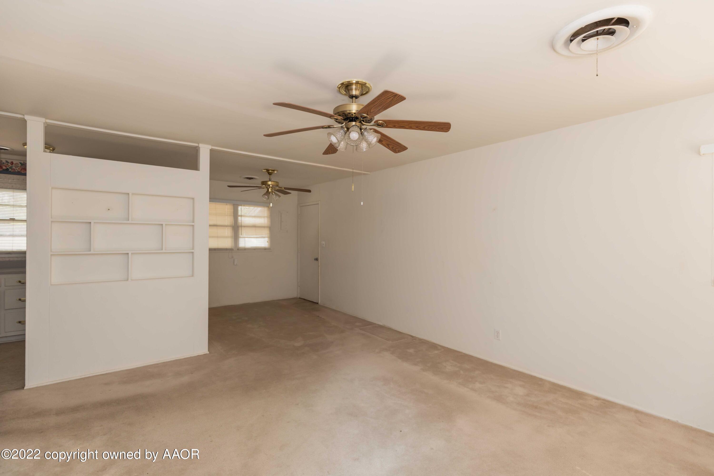 5138 Crockett Street Amarillo, TX 79110 - Photo 7 of 35 an empty room with windows and fan