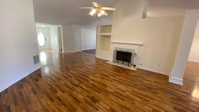 a view of a livingroom with wooden floor