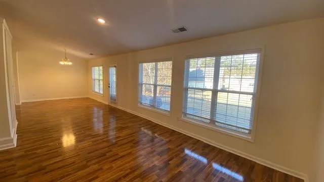 a kitchen with kitchen island granite countertop stainless steel appliances a stove top oven a sink and dishwasher