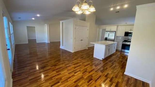 a kitchen with a stove and a refrigerator