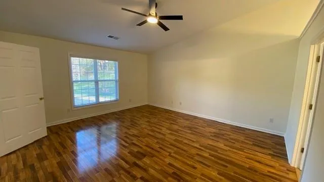a bathroom with a double vanity sink a mirror and a shower