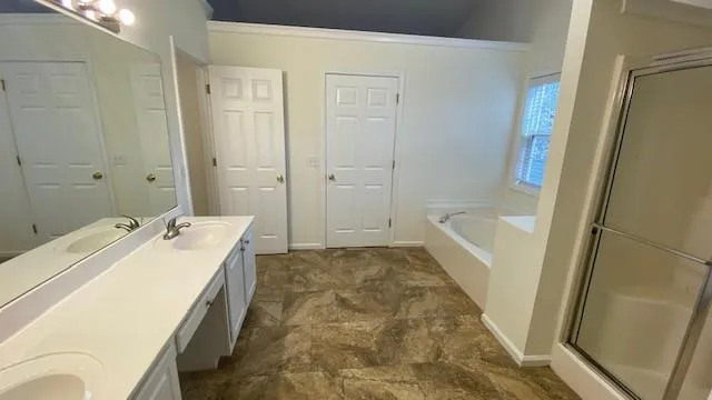 a bathroom with a tub and shower
