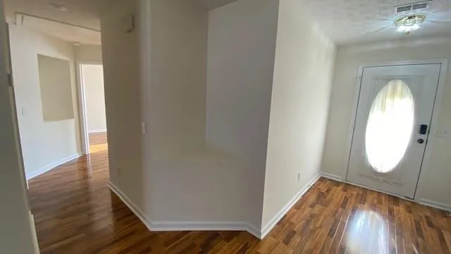 a bathroom with a tub shower and a sink