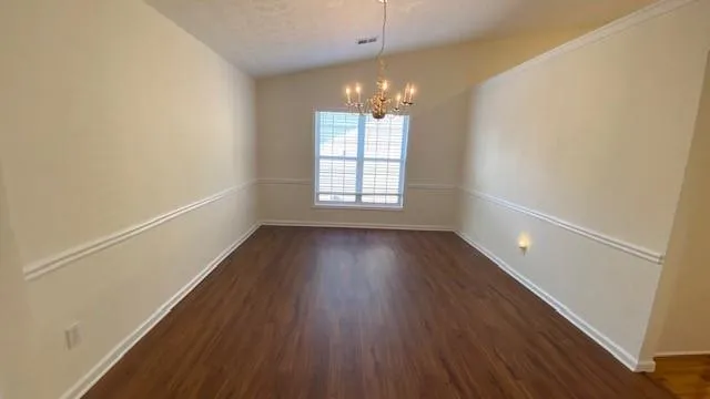 a view of a room with wooden floor and staircase