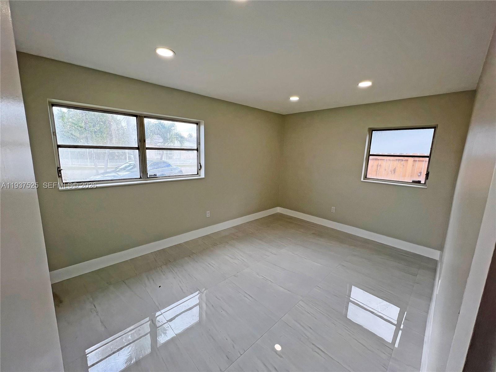 11962 Southwest 37th Terrace Miami, FL 33175 - Photo 12 of 24 an empty room with a window