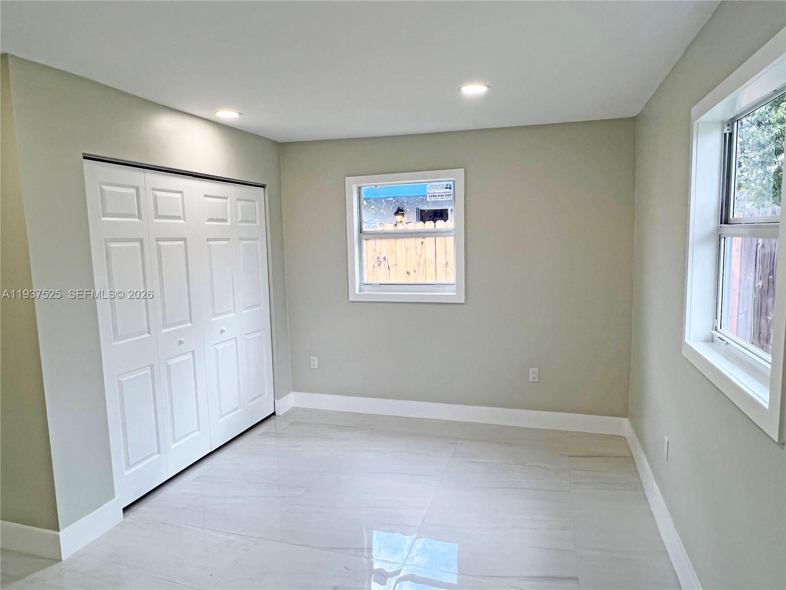 11962 Southwest 37th Terrace Miami, FL 33175 - Photo 19 of 24 a view of room with window and hardwood floor
